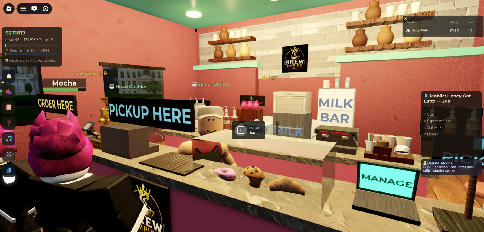A barista in apron working the counter of the Candy café while customers queue